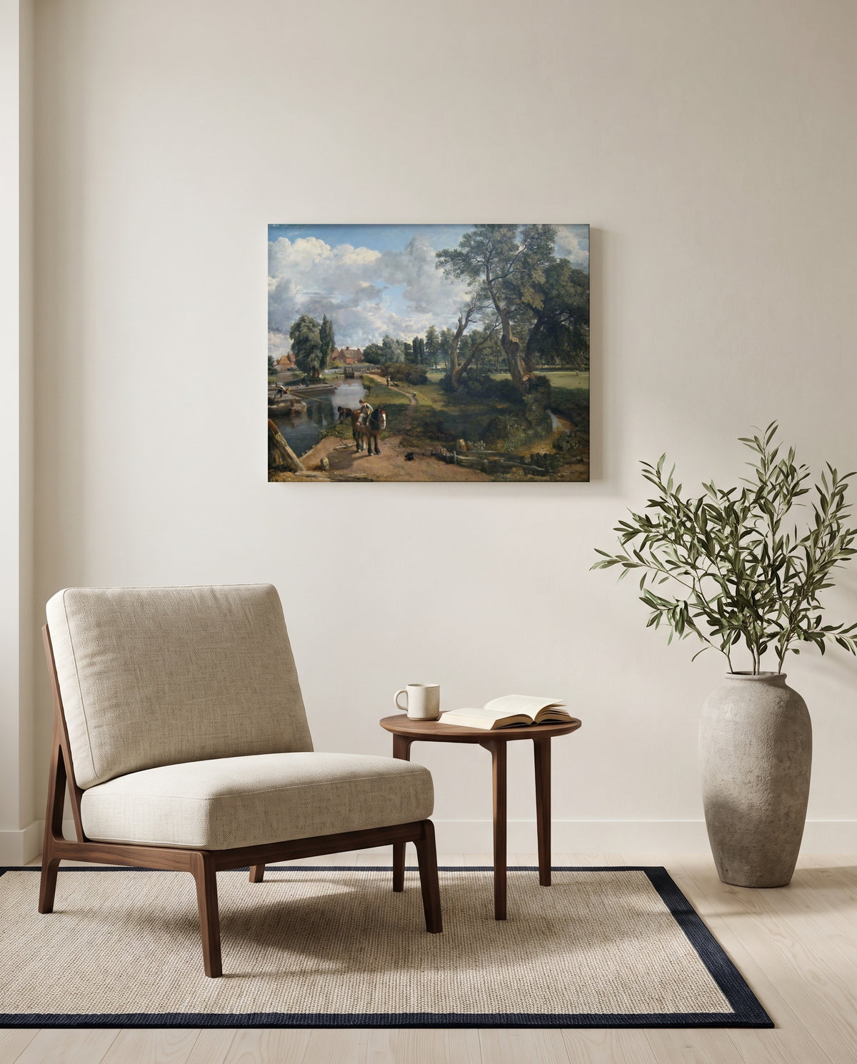 Flatford Mill by John Constable as a stretched canvas above a linen lounge chair in a reading corner