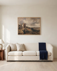Hadleigh Castle by John Constable framed in natural oak above a cream sofa in a warm living room