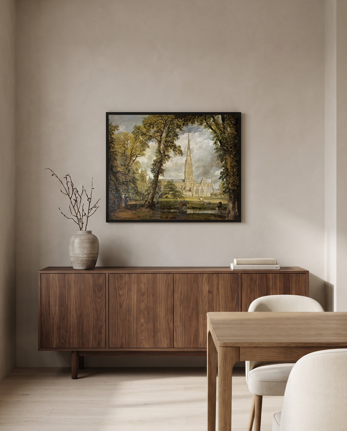 Salisbury Cathedral by John Constable in a black frame above a walnut sideboard in a dining room