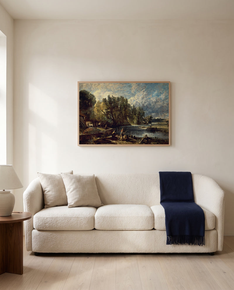 Stratford Mill by John Constable framed in natural oak above a cream sofa in a warm living room