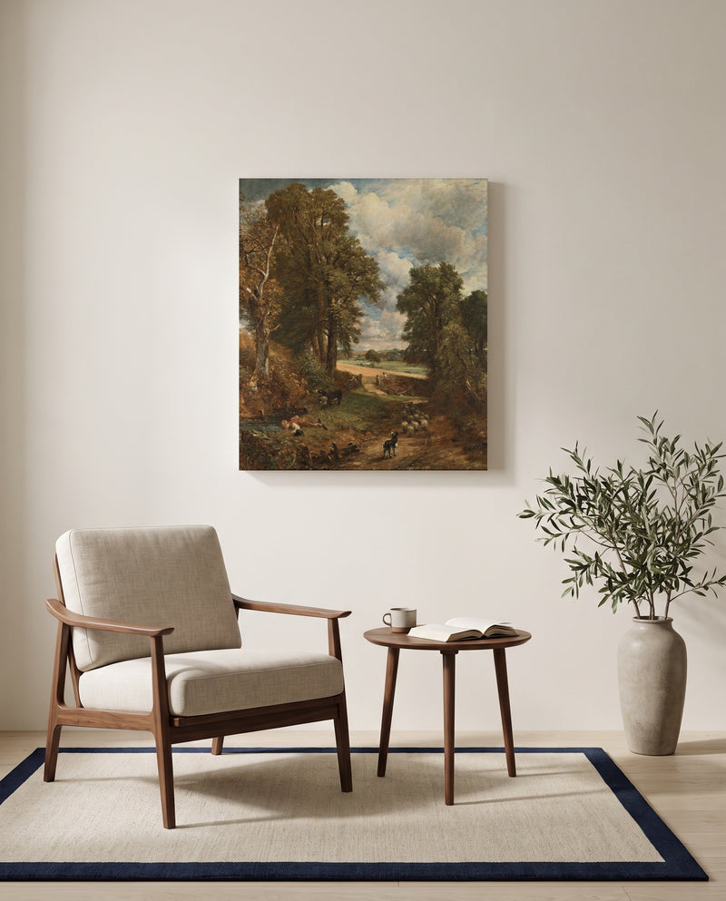 The Cornfield by John Constable as a stretched canvas above a linen lounge chair in a reading corner