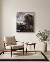 The Lock by John Constable as a stretched canvas above a linen lounge chair in a reading corner