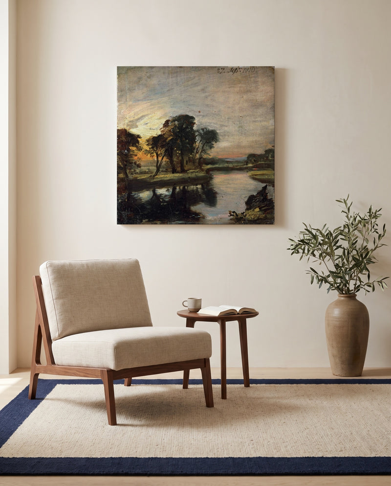 The Stour by John Constable as a stretched canvas above a linen lounge chair in a reading corner