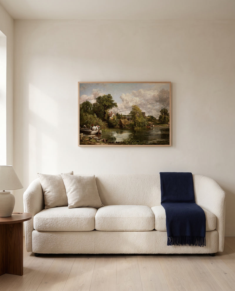 The White Horse by John Constable framed in natural oak above a cream sofa in a warm living room