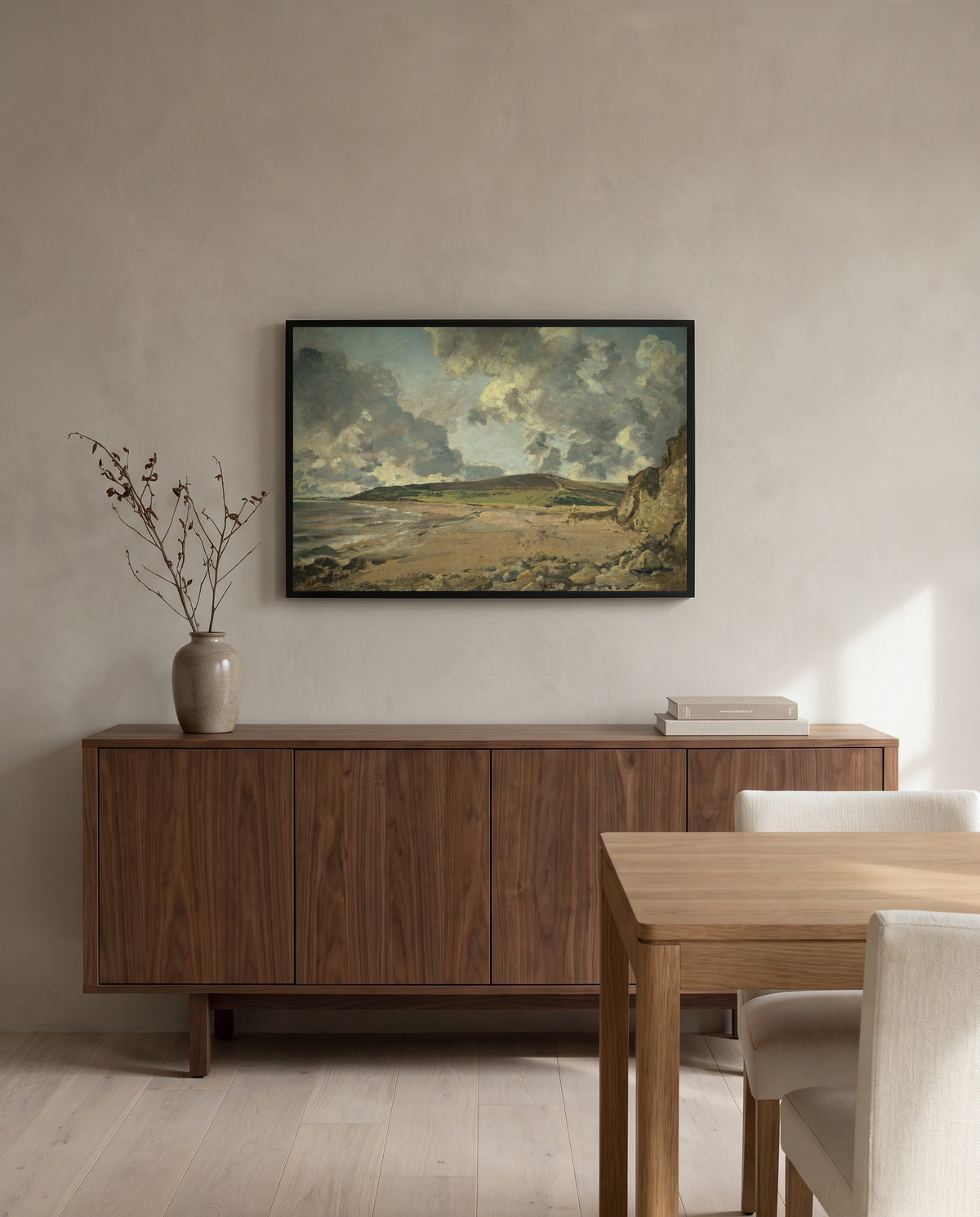 Weymouth Bay by John Constable in a black frame above a walnut sideboard in a dining room