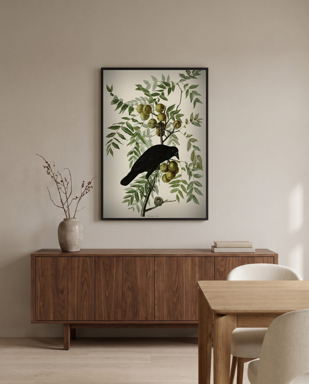 American Crow by John James Audubon in a black frame above a walnut sideboard in a dining room