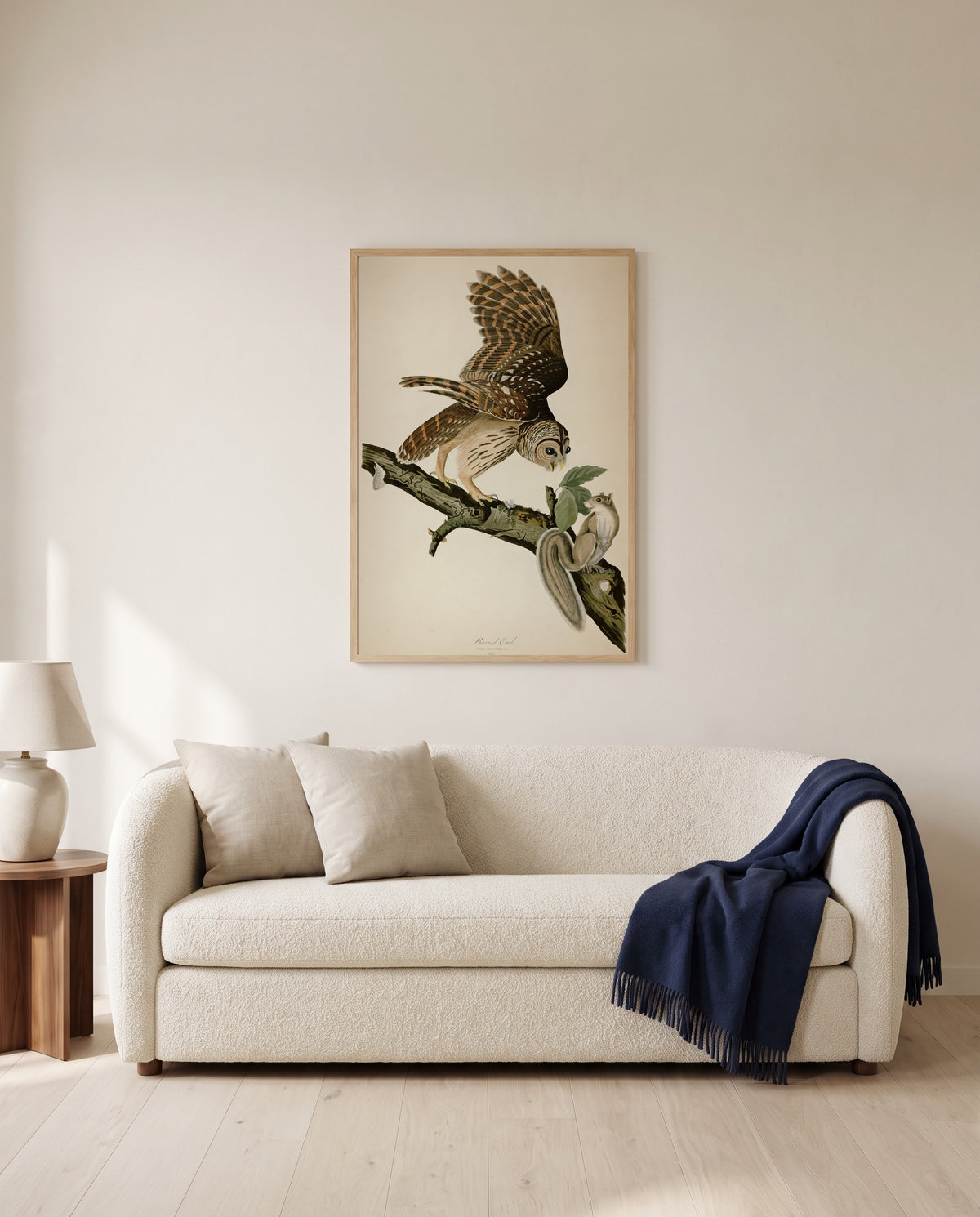 Barred Owl by John James Audubon framed in natural oak above a cream sofa in a warm living room