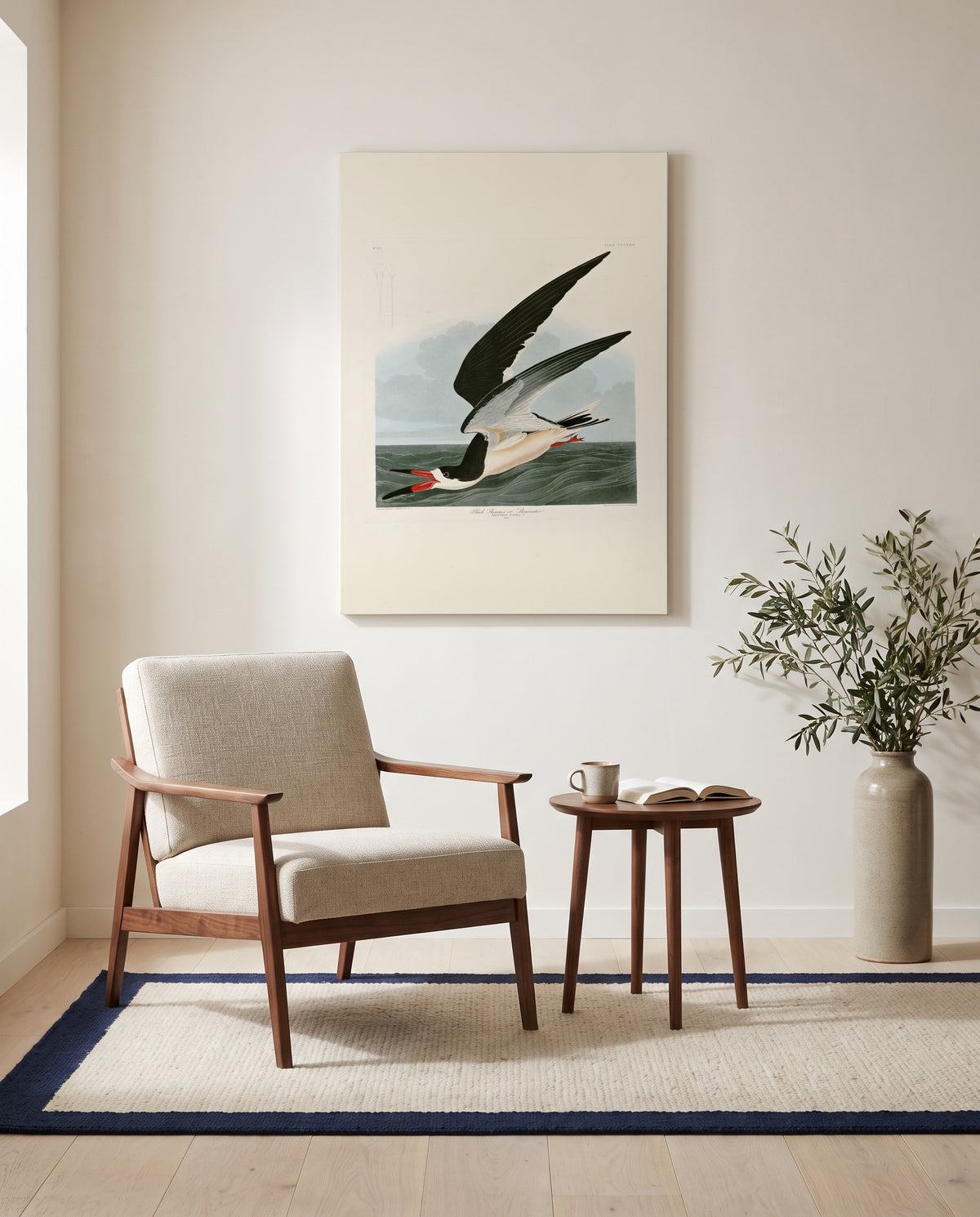 Black Skimmer by John James Audubon as a stretched canvas above a linen lounge chair in a reading corner
