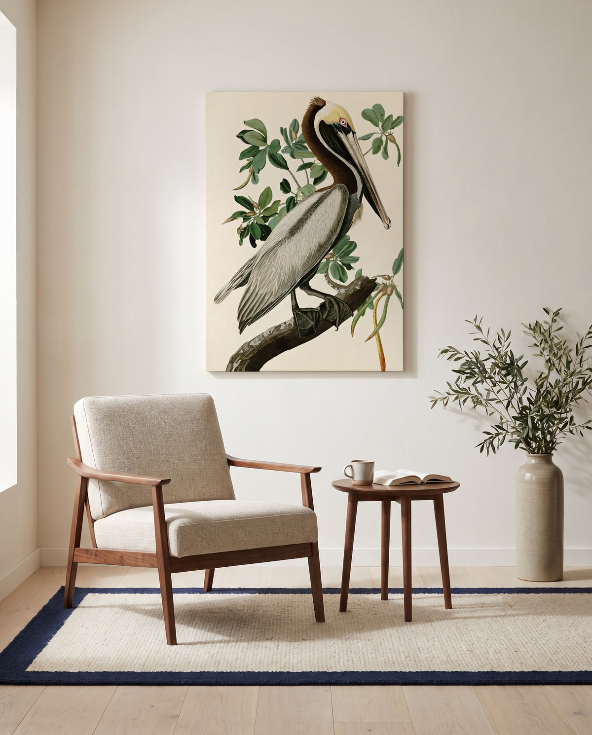 Brown Pelican by John James Audubon as a stretched canvas above a linen lounge chair in a reading corner