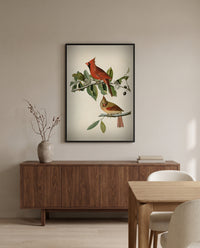 Cardinal Grosbeak by John James Audubon in a black frame above a walnut sideboard in a dining room
