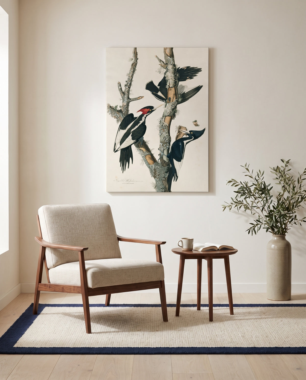 Ivory-billed Woodpecker by John James Audubon as a stretched canvas above a linen lounge chair in a reading corner