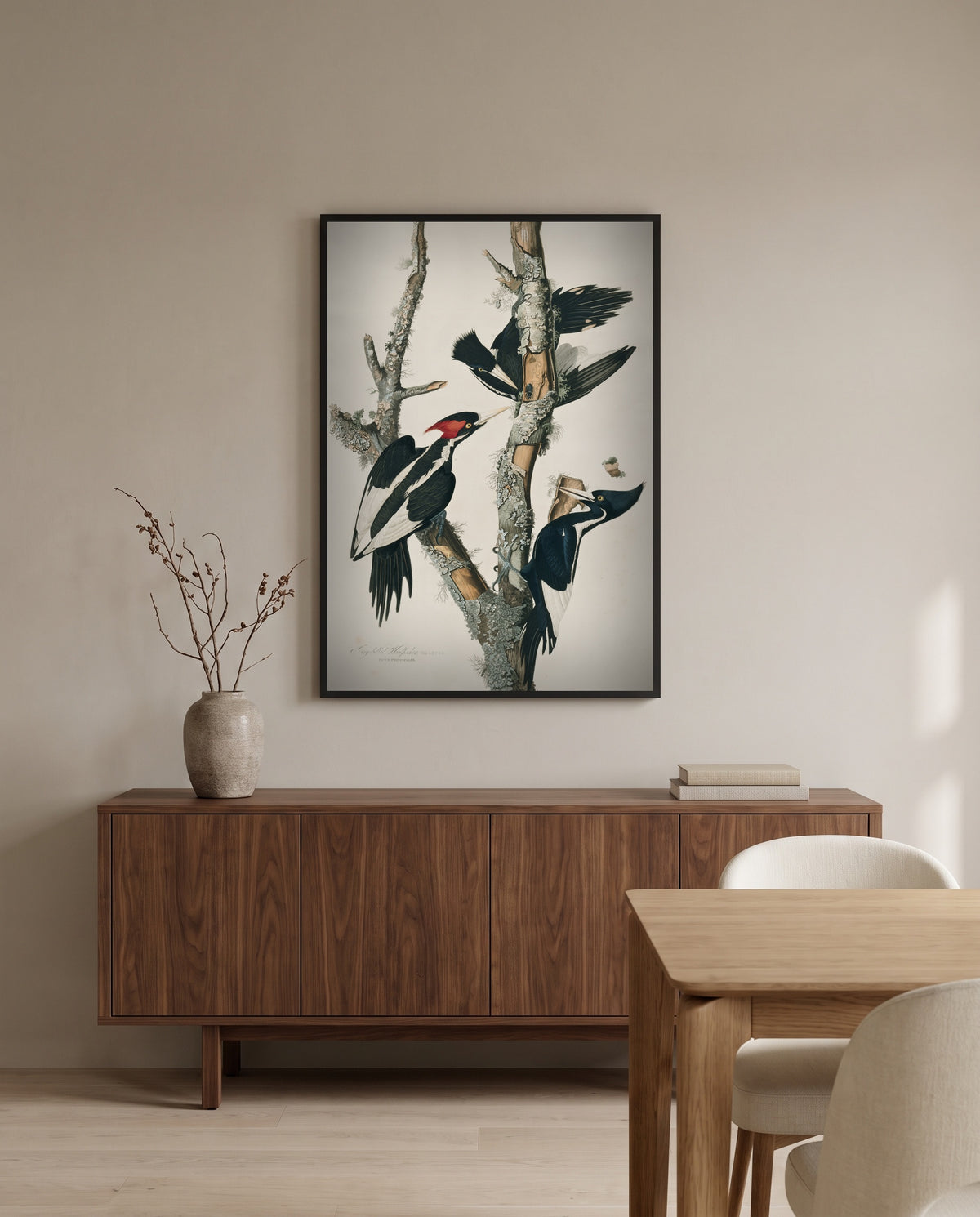 Ivory-billed Woodpecker by John James Audubon in a black frame above a walnut sideboard in a dining room