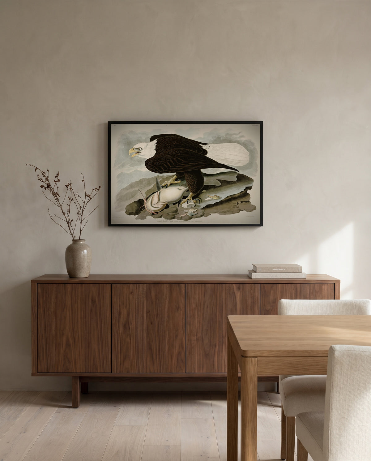 White-headed Eagle by John James Audubon in a black frame above a walnut sideboard in a dining room