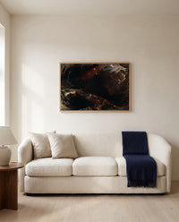 The Deluge by John Martin framed in natural oak above a cream sofa in a warm living room