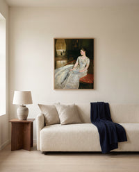 Mrs. Cecil Wade by John Singer Sargent framed in natural oak above a cream sofa in a warm living room