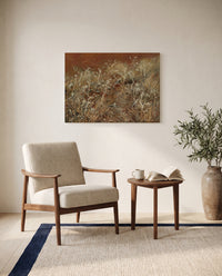 Thistles by John Singer Sargent as a stretched canvas above a linen lounge chair in a reading corner