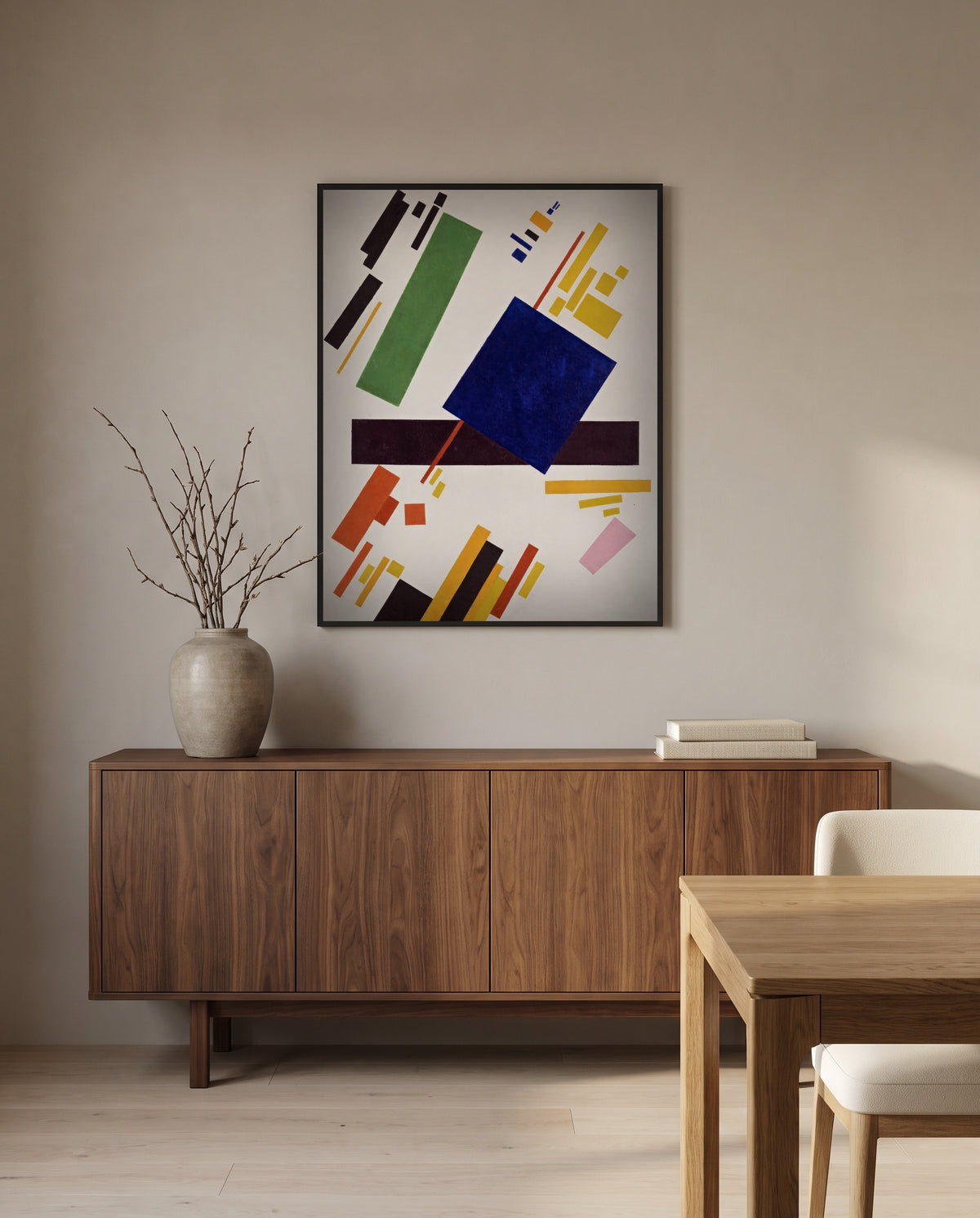 Suprematist Composition by Kazimir Malevich in a black frame above a walnut sideboard in a dining room