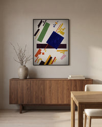 Suprematist Composition by Kazimir Malevich in a black frame above a walnut sideboard in a dining room