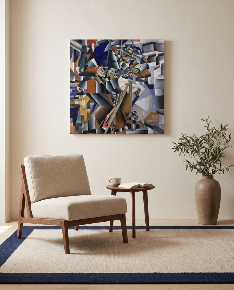 The Knife Grinder by Kazimir Malevich as a stretched canvas above a linen lounge chair in a reading corner
