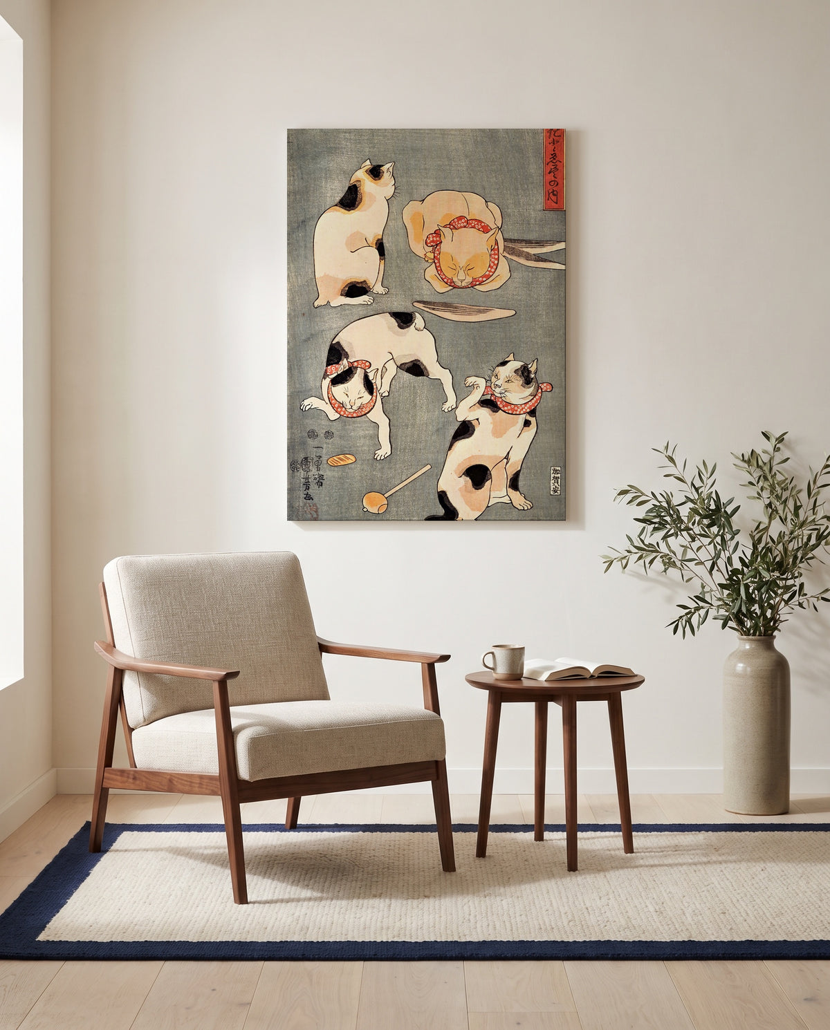 Four Cats (Proverbs) by Utagawa Kuniyoshi as a stretched canvas above a linen lounge chair in a reading corner
