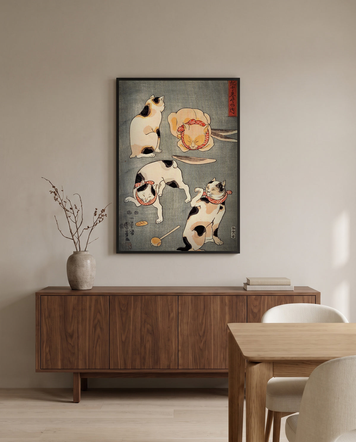 Four Cats (Proverbs) by Utagawa Kuniyoshi in a black frame above a walnut sideboard in a dining room