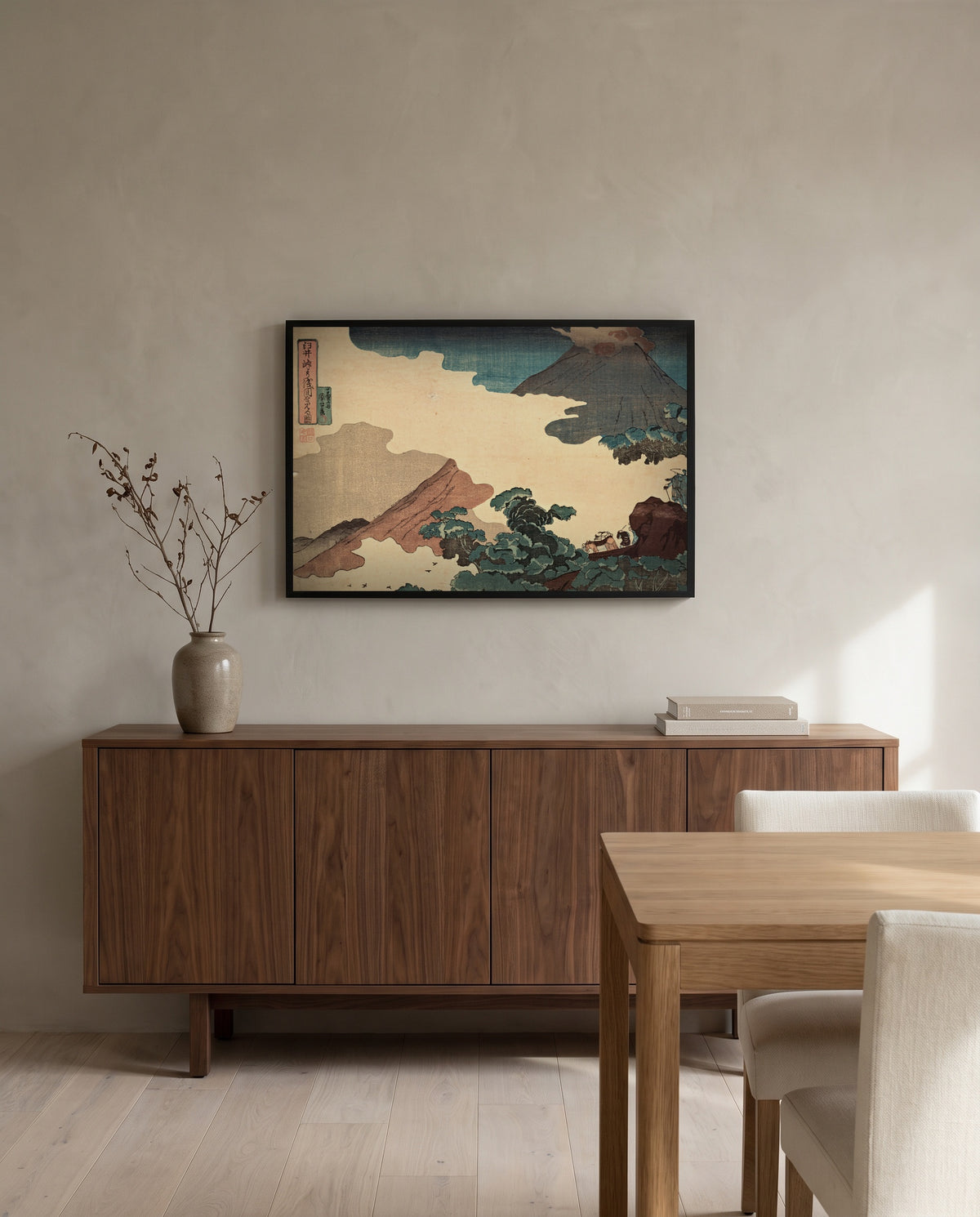 Mount Asama from Usui Pass by Utagawa Kuniyoshi in a black frame above a walnut sideboard in a dining room