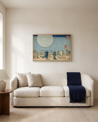 New Yoshiwara by Utagawa Kuniyoshi framed in natural oak above a cream sofa in a warm living room