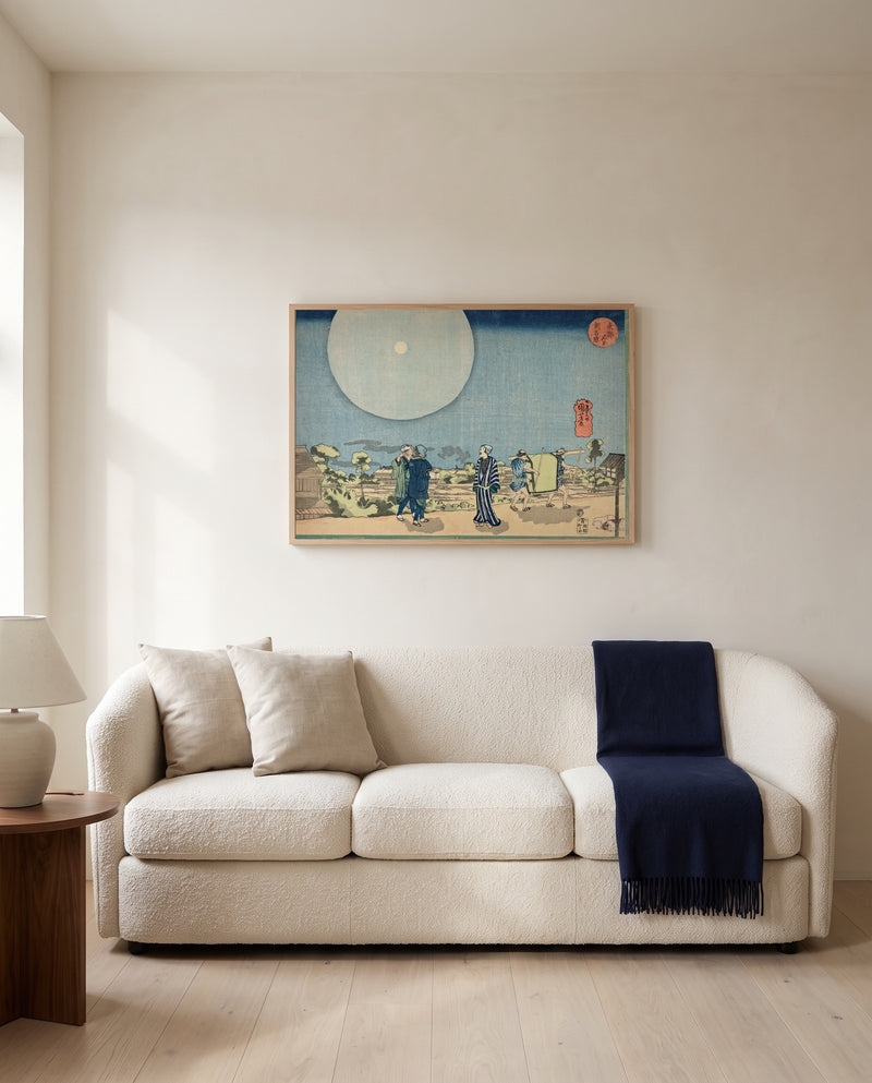 New Yoshiwara by Utagawa Kuniyoshi framed in natural oak above a cream sofa in a warm living room