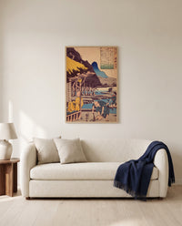 The Poet’s Cabin by Utagawa Kuniyoshi framed in natural oak above a cream sofa in a warm living room