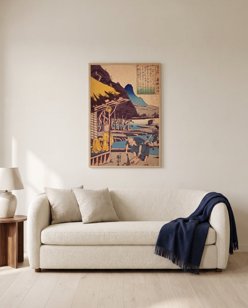 The Poet’s Cabin by Utagawa Kuniyoshi framed in natural oak above a cream sofa in a warm living room