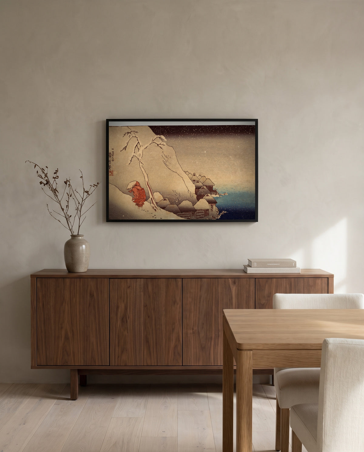 Travelling in a Snowstorm by Utagawa Kuniyoshi in a black frame above a walnut sideboard in a dining room