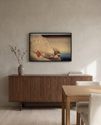 Travelling in a Snowstorm by Utagawa Kuniyoshi in a black frame above a walnut sideboard in a dining room