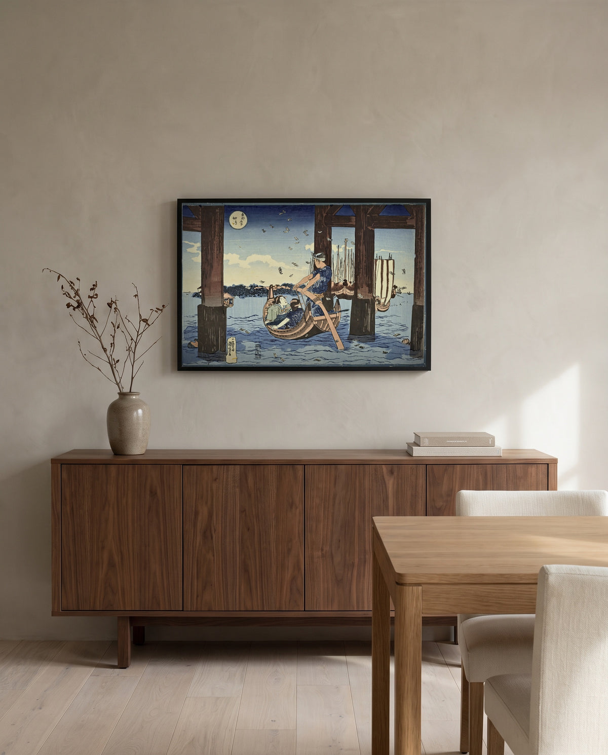 Tsukuda Island by Utagawa Kuniyoshi in a black frame above a walnut sideboard in a dining room