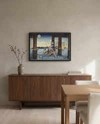 Tsukuda Island by Utagawa Kuniyoshi in a black frame above a walnut sideboard in a dining room
