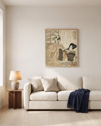 Woman with a Cat by Utagawa Kuniyoshi framed in natural oak above a cream sofa in a warm living room