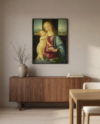 Madonna with a Pomegranate by Lorenzo di Credi in a black frame above a walnut sideboard in a dining room