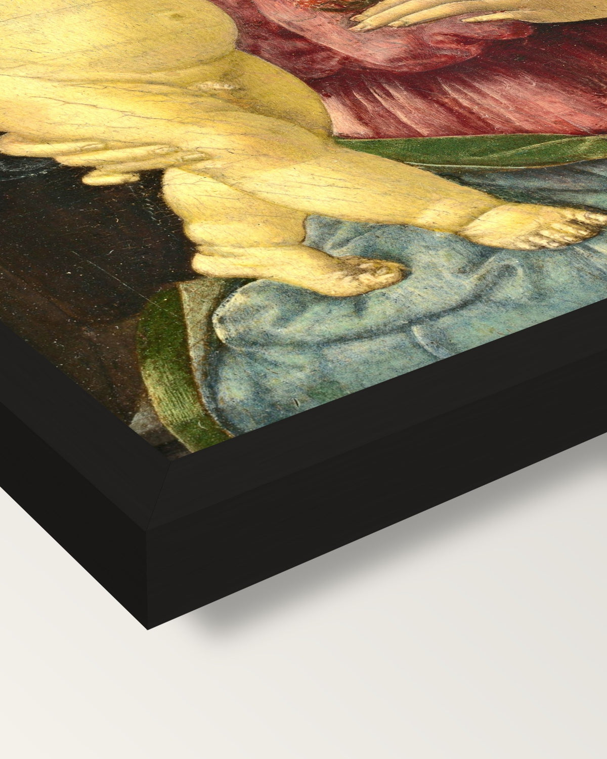 Madonna with a Pomegranate framed print, corner close-up: black moulding, mitred, the print set just below its edge