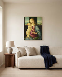 Madonna with a Pomegranate by Lorenzo di Credi framed in natural oak above a cream sofa in a warm living room