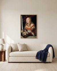 Judith by Lucas Cranach the Elder framed in natural oak above a cream sofa in a warm living room