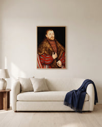 Portrait of Joachim II by Lucas Cranach the Elder framed in natural oak above a cream sofa in a warm living room