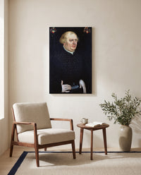 Portrait of Johann Feige by Lucas Cranach the Elder as a stretched canvas above a linen lounge chair in a reading corner