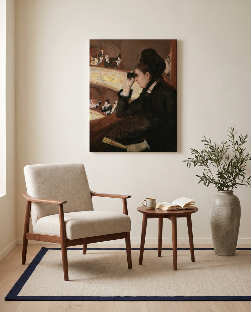 In the Loge by Mary Cassatt as a stretched canvas above a linen lounge chair in a reading corner