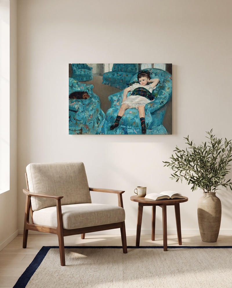 Girl in a Blue Armchair by Mary Cassatt as a stretched canvas above a linen lounge chair in a reading corner