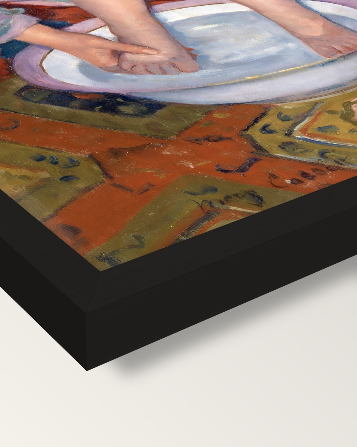 The Child’s Bath by Mary Cassatt framed print, corner close-up: black moulding, mitred, the print set just below its edge