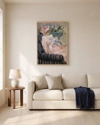 The Cup of Tea by Mary Cassatt framed in natural oak above a cream sofa in a warm living room