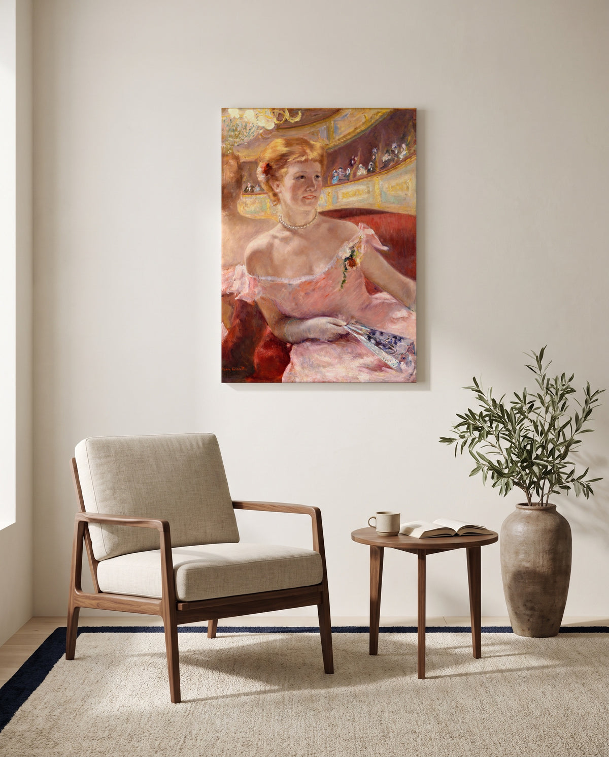Woman with a Pearl Necklace by Mary Cassatt as a stretched canvas above a linen lounge chair in a reading corner