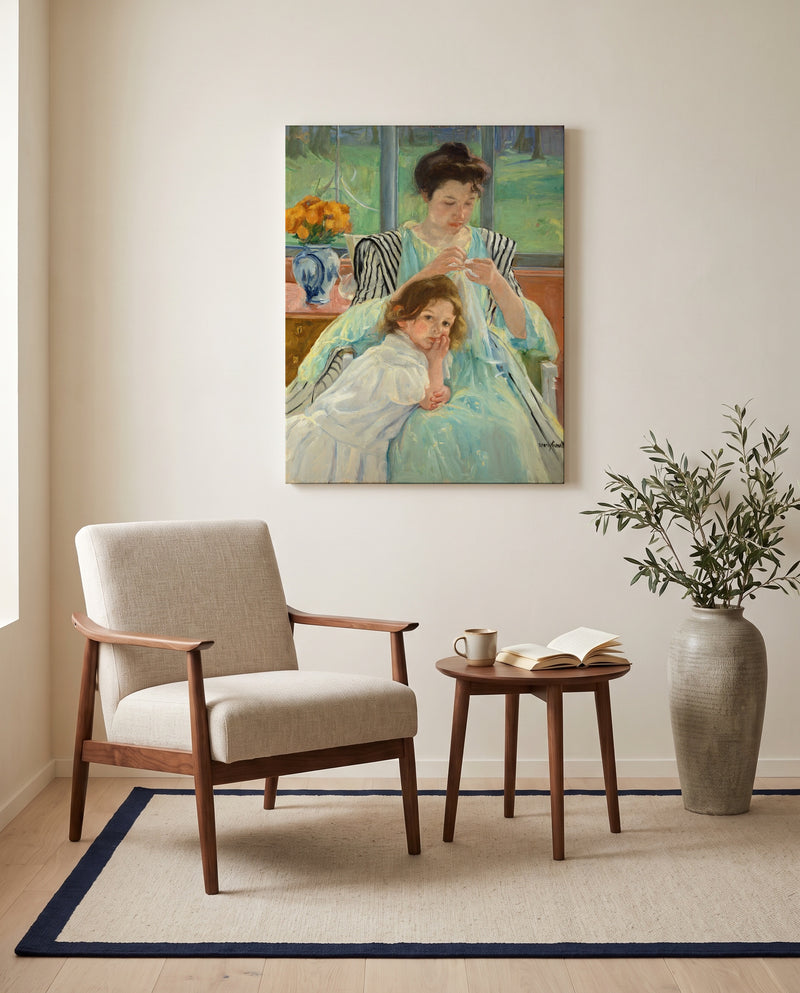 Young Mother Sewing by Mary Cassatt as a stretched canvas above a linen lounge chair in a reading corner