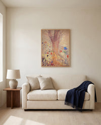Buddha by Odilon Redon framed in natural oak above a cream sofa in a warm living room