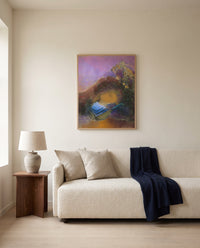 Orpheus by Odilon Redon framed in natural oak above a cream sofa in a warm living room