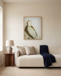 Portrait of Madame Bonger by Odilon Redon framed in natural oak above a cream sofa in a warm living room